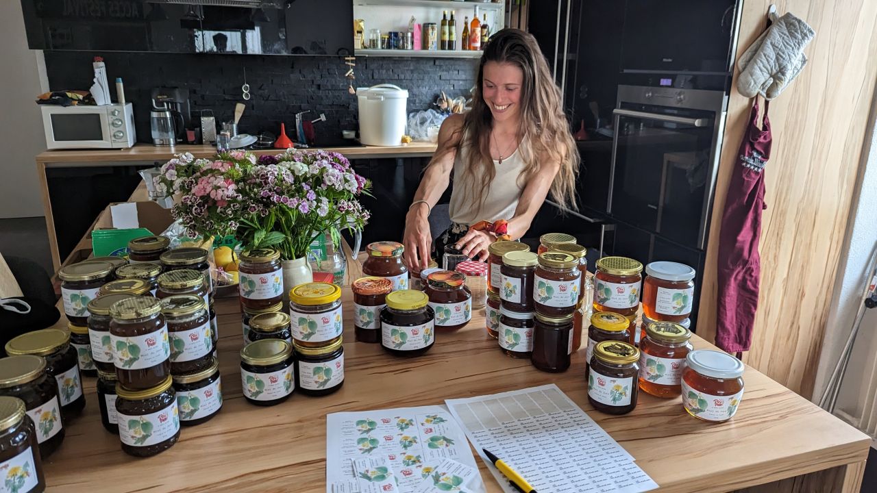 Florine is labeling the jars for the honey harvest of last year.